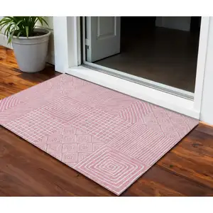 Photo of Pink And Ivory Geometric Washable Indoor Outdoor Area Rug