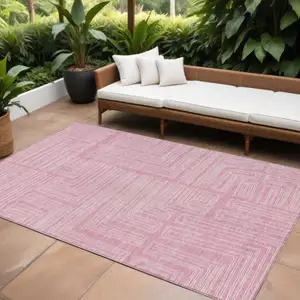 Photo of Pink And Ivory Geometric Washable Indoor Outdoor Area Rug
