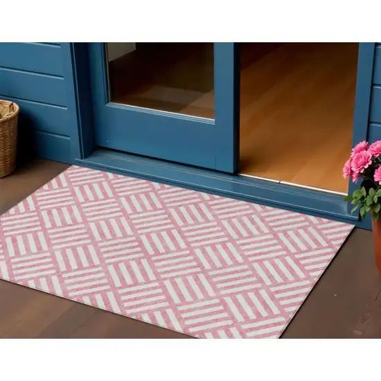 Pink And Ivory Geometric Washable Indoor Outdoor Area Rug Photo 1