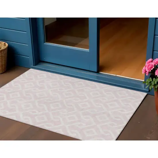 Pink And Ivory Geometric Washable Indoor Outdoor Area Rug Photo 1