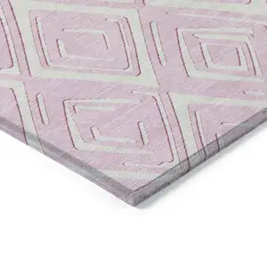 Photo of Pink And Ivory Geometric Washable Indoor Outdoor Area Rug