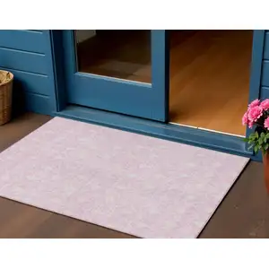 Photo of Pink And Ivory Geometric Washable Indoor Outdoor Area Rug