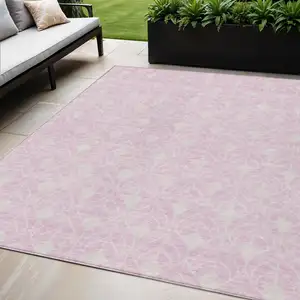 Photo of Pink And Ivory Geometric Washable Indoor Outdoor Area Rug