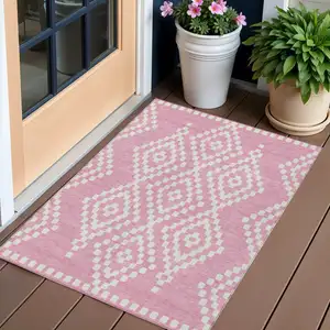 Photo of Pink And Ivory Geometric Washable Indoor Outdoor Area Rug