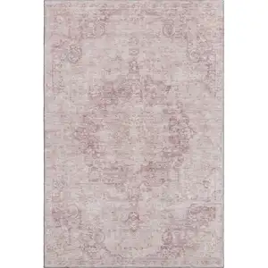Photo of Pink And Ivory Oriental Washable Area Rug With UV Protection