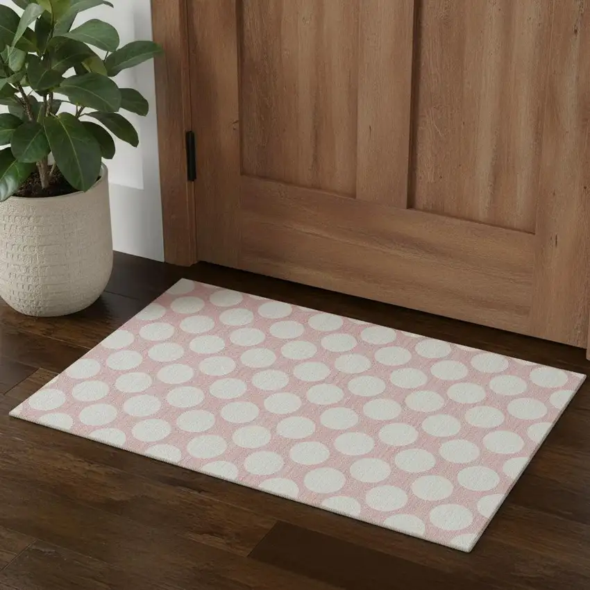 Pink And Ivory Polka Dot Washable Area Rug With UV Protection Photo 1