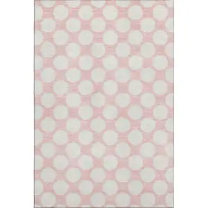 Photo of Pink And Ivory Polka Dot Washable Area Rug With UV Protection