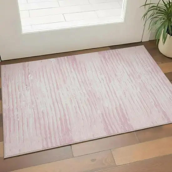 Pink And Ivory Striped Washable Area Rug With UV Protection Photo 1