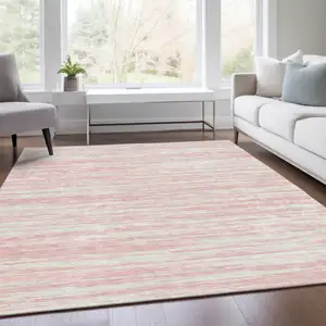 Photo of Pink And Ivory Striped Washable Area Rug With UV Protection