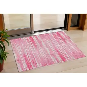 Photo of Pink And Ivory Striped Washable Indoor Outdoor Area Rug