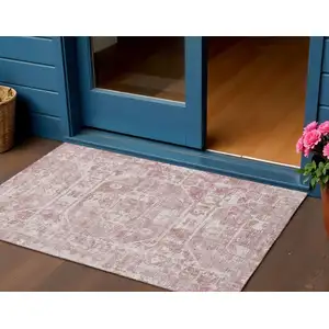 Photo of Pink And Ivory Tribal Washable Indoor Outdoor Area Rug