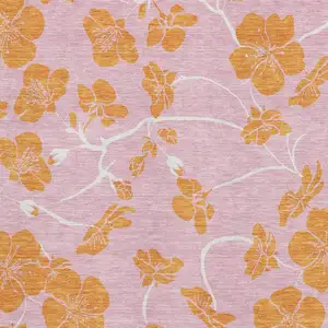 Photo of Pink And Orange Floral Washable Area Rug With UV Protection