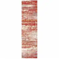 Photo of Pink And Red Abstract Hand Loomed Stain Resistant Runner Rug