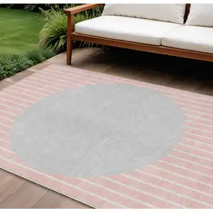Photo of Pink And Silver Striped Washable Indoor Outdoor Area Rug