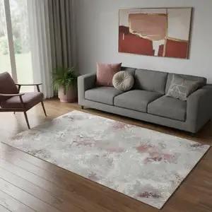 Photo of Pink And White Abstract Area Rug