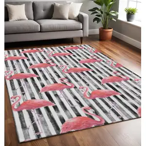 Photo of Pink Black And White Geometric Washable Area Rug With UV Protection