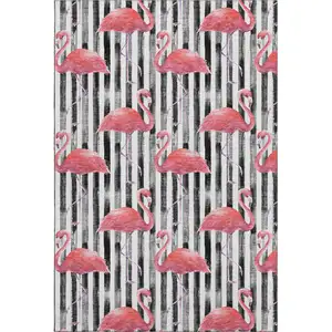 Photo of Pink Black And White Geometric Washable Area Rug With UV Protection