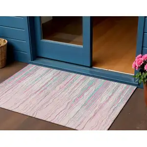 Photo of Pink Blue And Purple Striped Washable Indoor Outdoor Area Rug