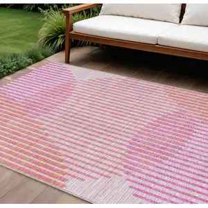 Photo of Pink Copper And Ivory Geometric Washable Indoor Outdoor Area Rug