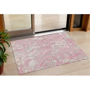 Photo of Pink Gray And Ivory Abstract Washable Indoor Outdoor Area Rug