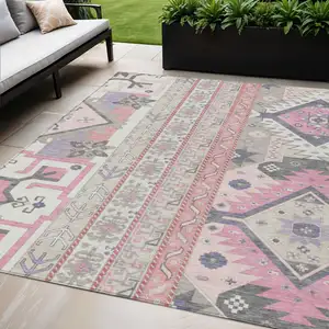 Photo of Pink Gray And Ivory Aztec Washable Indoor Outdoor Area Rug