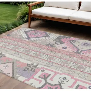 Photo of Pink Gray And Ivory Aztec Washable Indoor Outdoor Area Rug