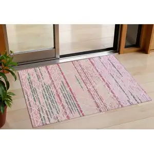 Photo of Pink Gray And Ivory Striped Washable Indoor Outdoor Area Rug