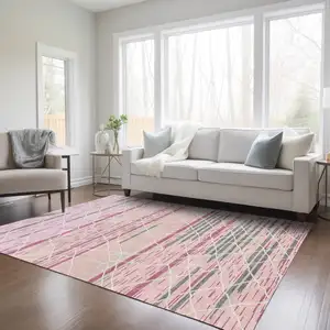 Photo of Pink Gray And Ivory Striped Washable Indoor Outdoor Area Rug