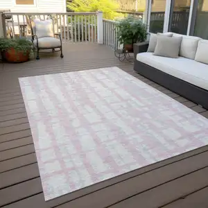 Photo of Pink Gray And Ivory Striped Washable Indoor Outdoor Area Rug