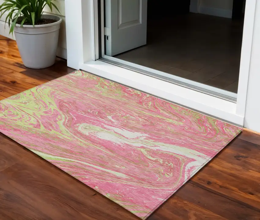 Pink Green And Ivory Abstract Washable Indoor Outdoor Area Rug Photo 1