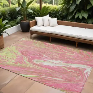 Photo of Pink Green And Ivory Abstract Washable Indoor Outdoor Area Rug