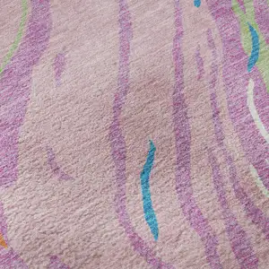 Photo of Pink Green And Orange Abstract Washable Area Rug With UV Protection