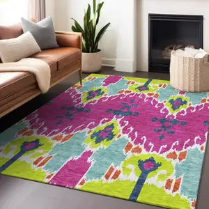 Photo of Pink Green And Teal Ikat Washable Area Rug With UV Protection