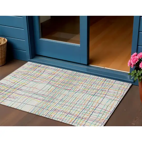 Pink Green And Yellow Striped Washable Indoor Outdoor Area Rug Photo 1