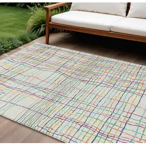 Photo of Pink Green And Yellow Striped Washable Indoor Outdoor Area Rug