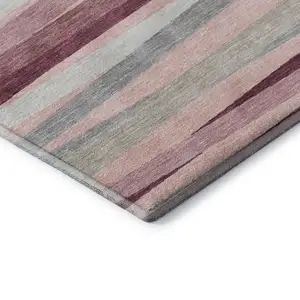 Photo of Pink Ivory And Blush Striped Washable Area Rug With UV Protection