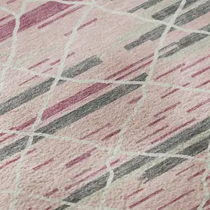Photo of Pink Ivory And Gray Striped Washable Area Rug With UV Protection