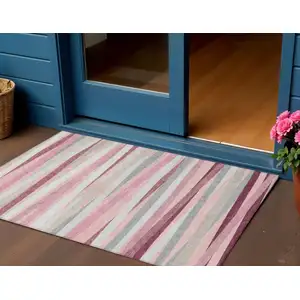 Photo of Pink Ivory And Gray Striped Washable Indoor Outdoor Area Rug