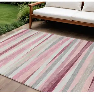 Photo of Pink Ivory And Gray Striped Washable Indoor Outdoor Area Rug