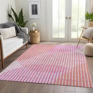 Photo of Pink Ivory And Orange Geometric Washable Area Rug With UV Protection