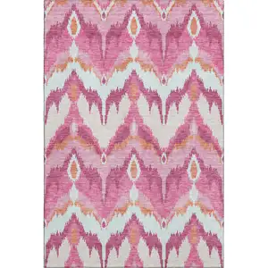 Photo of Pink Ivory And Orange Ikat Washable Area Rug With UV Protection