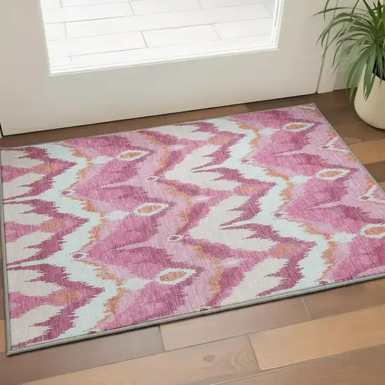 Pink Ivory And Orange Ikat Washable Area Rug With UV Protection Photo 2