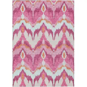 Photo of Pink Mauve And Orange Ikat Washable Indoor Outdoor Area Rug