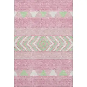 Photo of Pink Mint Green And Ivory Southwestern Washable Area Rug With UV Protection