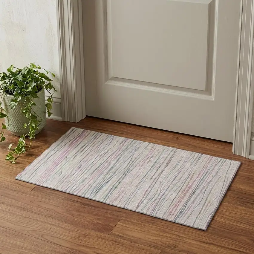 Pink Mint Green And Ivory Striped Washable Area Rug With UV Protection Photo 1