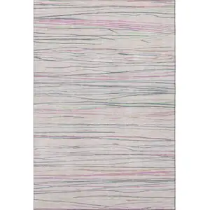 Photo of Pink Mint Green And Ivory Striped Washable Area Rug With UV Protection