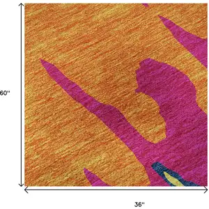 Photo of Pink Orange Blue And Lime Green Abstract Washable Area Rug With UV Protection