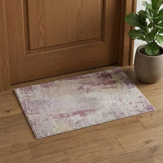 Pink Peach And Ivory Abstract Washable Area Rug With UV Protection Photo 1