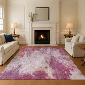 Photo of Pink Peach And Ivory Abstract Washable Area Rug With UV Protection