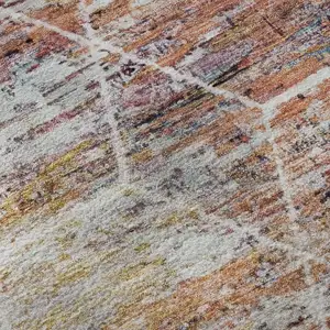 Photo of Pink Peach And Ivory Geometric Washable Area Rug With UV Protection